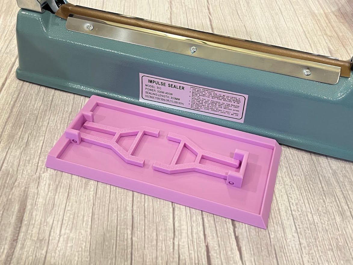 Lavender Heat Sealer Table upside down showing the legs folded in for easy storage.