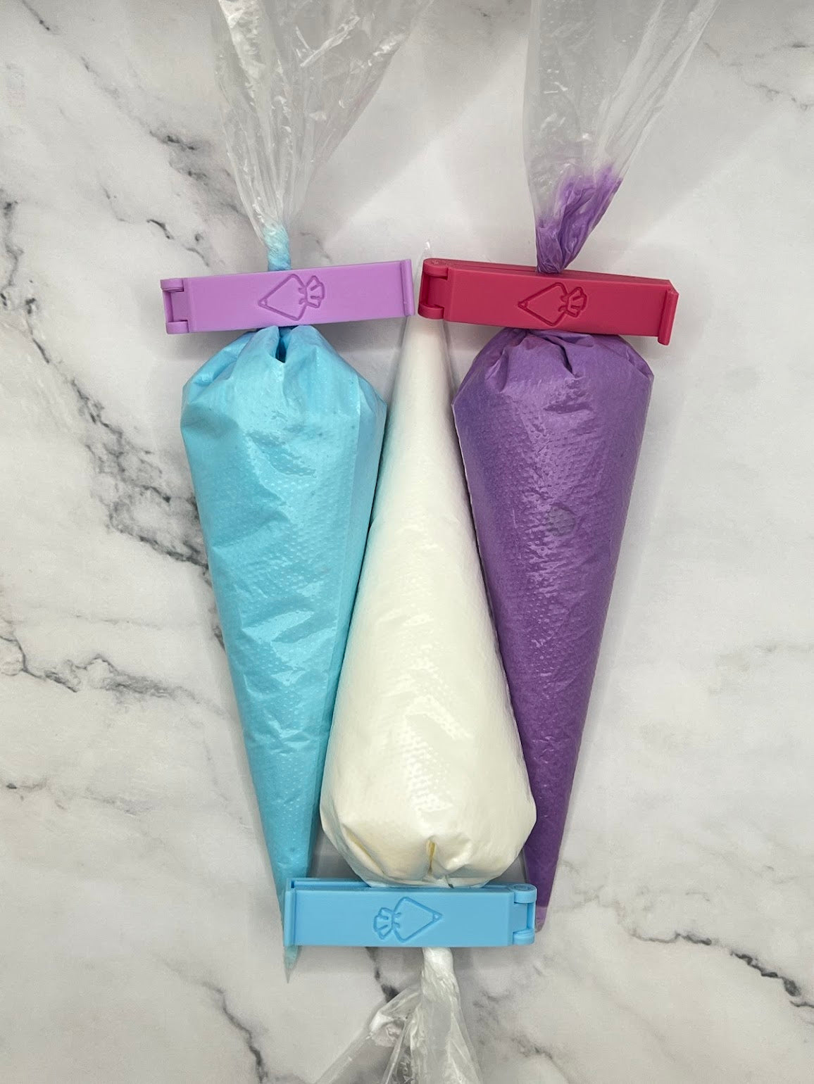 Tipless piping bags with clips positioned in a pattern.